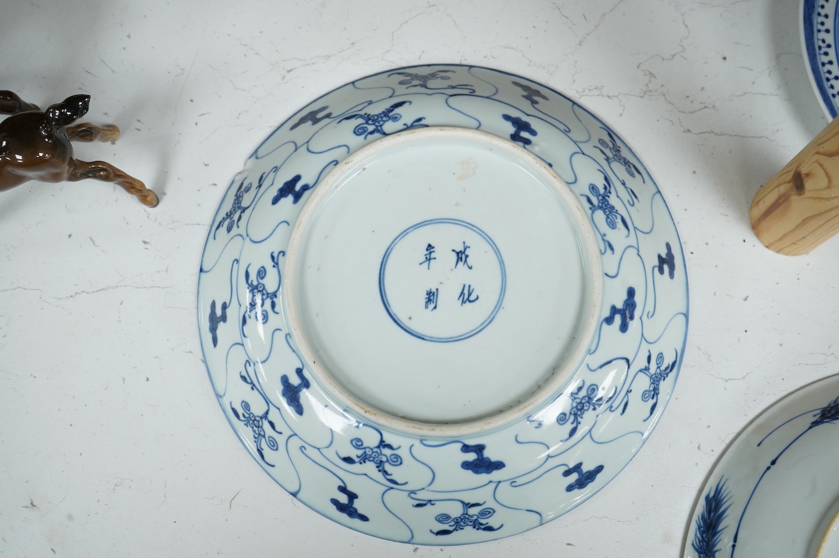 Three Chinese blue and white plates, largest 26cm